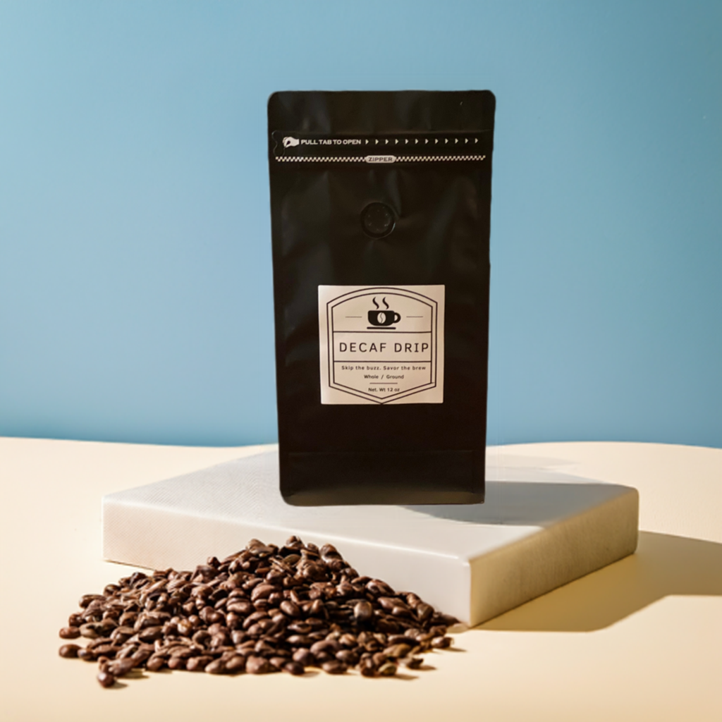 A package of coffee beans with the label 'Mellow Mornings' on a table, with scattered beans and a plant backdrop.